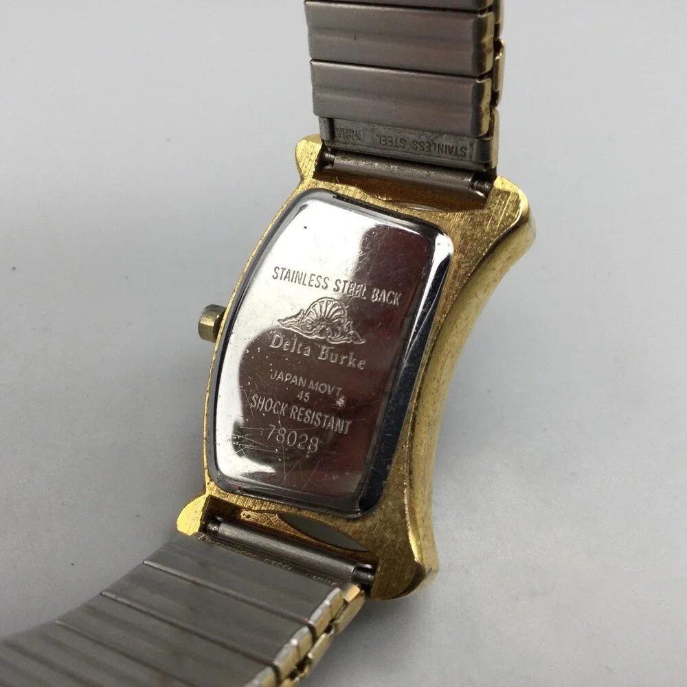 Delta Burke Womens Watch 25mm Gold Tone Asymmetrical Stretch Band New Battery